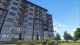 North Gate Apartments — vedere laterală bloc P+8E cu spații verzi